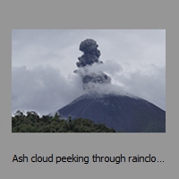 Ash cloud peeking through rainclouds